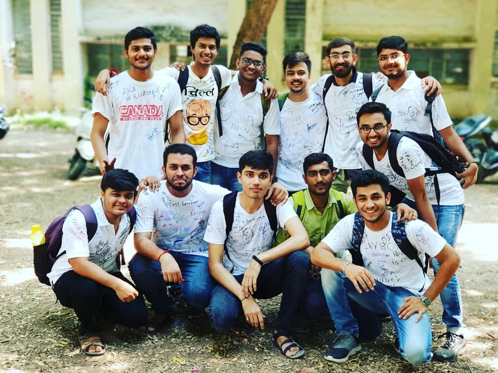Ronak with college friends on farewell day in signed white t-shirts