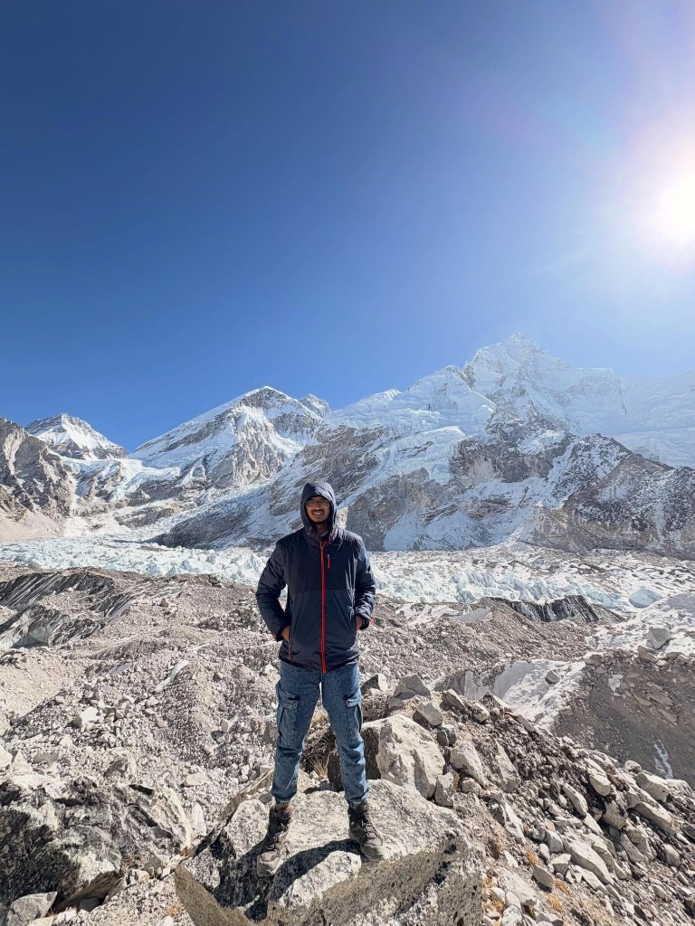 Ronak standing in the Himalayas